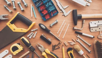 housework-tools-top-view-on-workshop-desk-PQ8TBPD