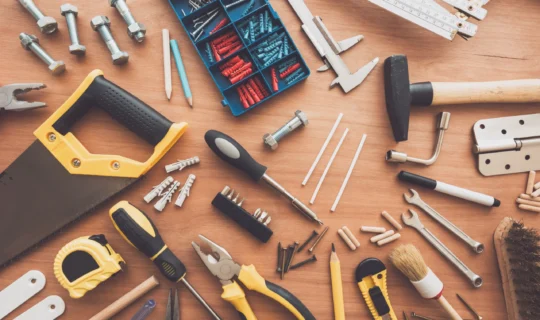 housework-tools-top-view-on-workshop-desk-PQ8TBPD